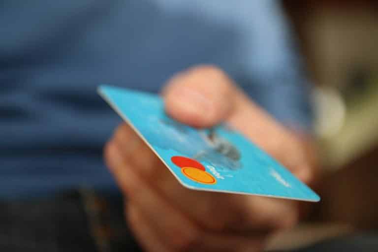 Close-up of a hand holding a payment card