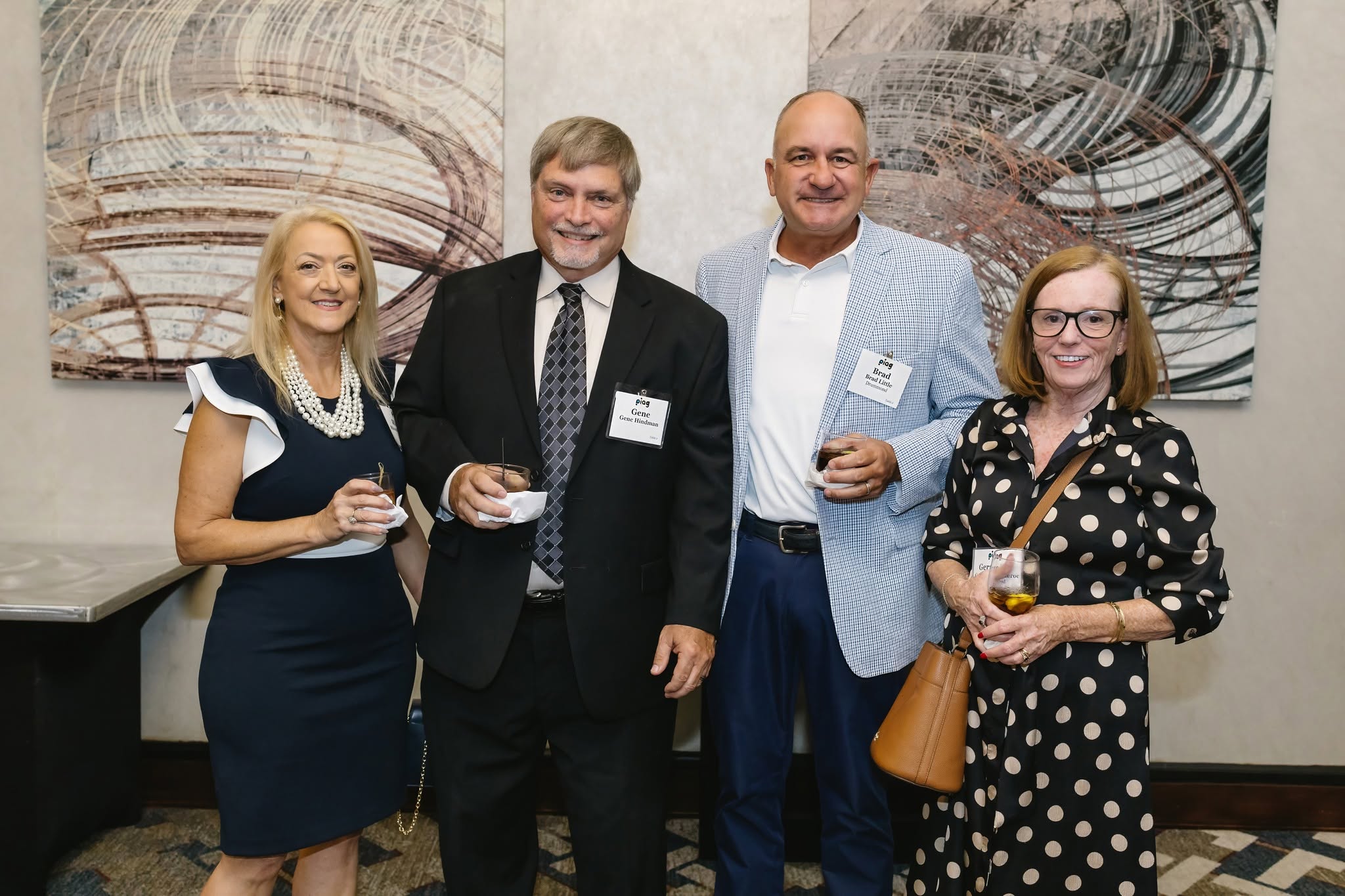Gene Hindman and Brad Little of Drummond with two guests at the PIAG imPRESS 2026 reception.